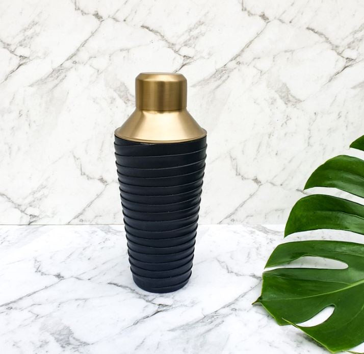 Leather and brass cocktail shaker